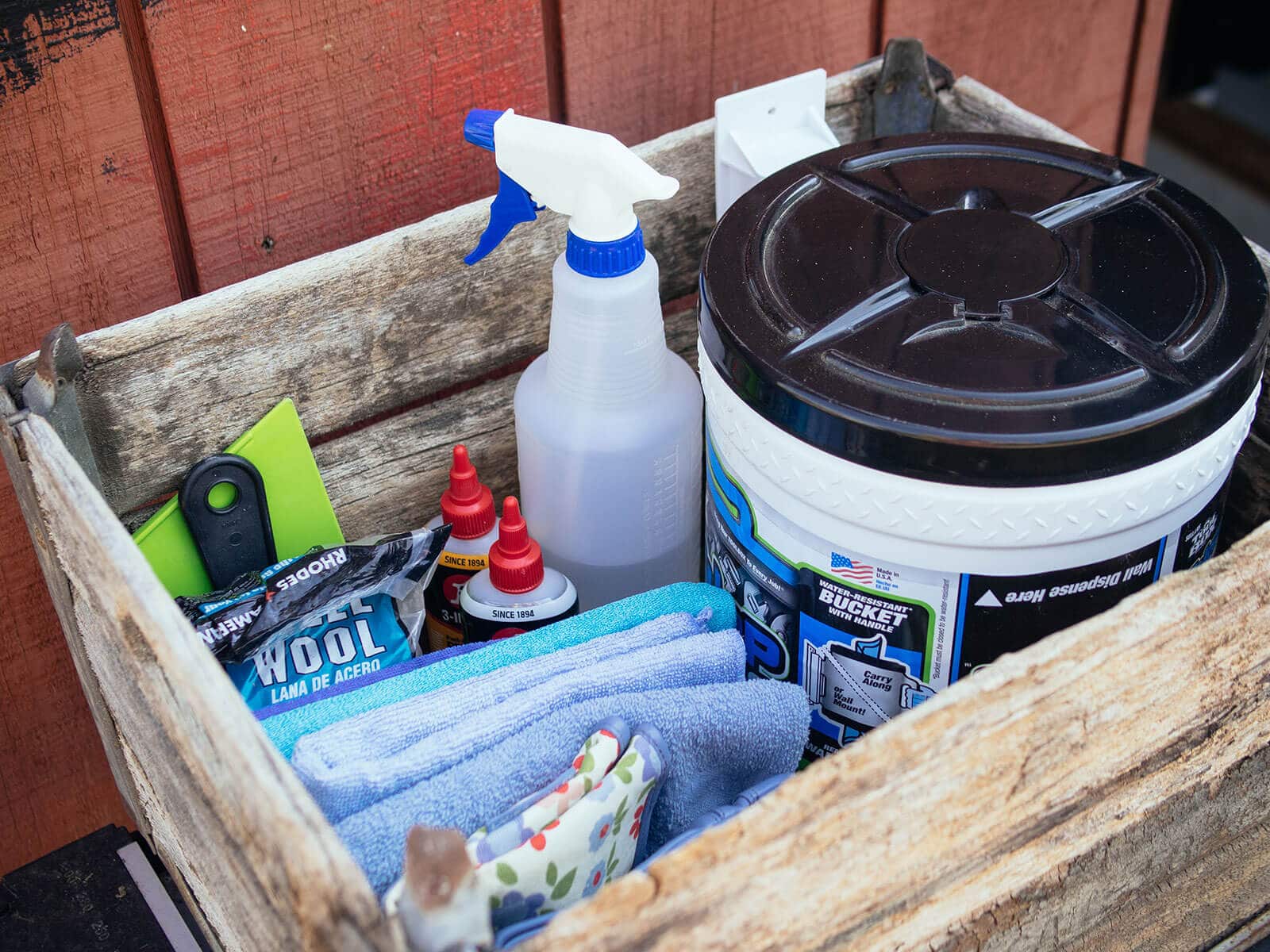Wooden crate filled with various tool cleaning supplies