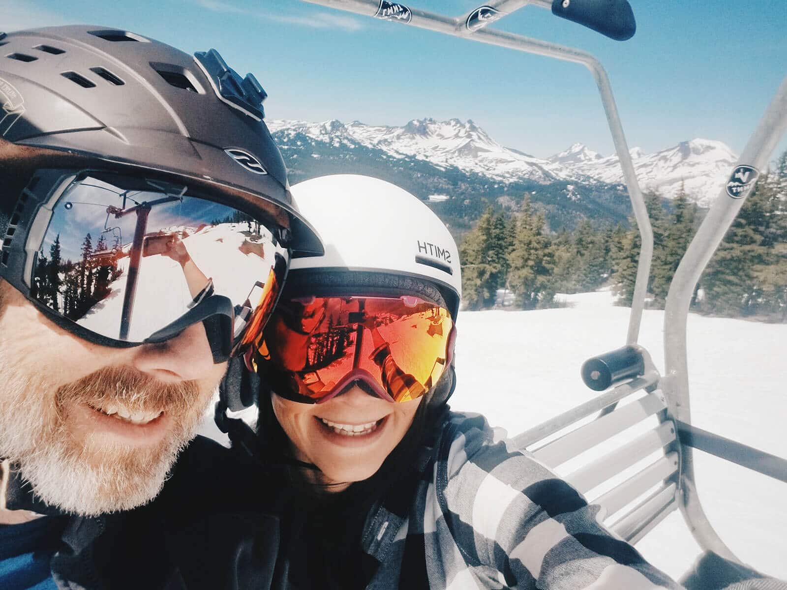 Sitting on a chair lift at Mount Bachelor with the Three Sisters in the background