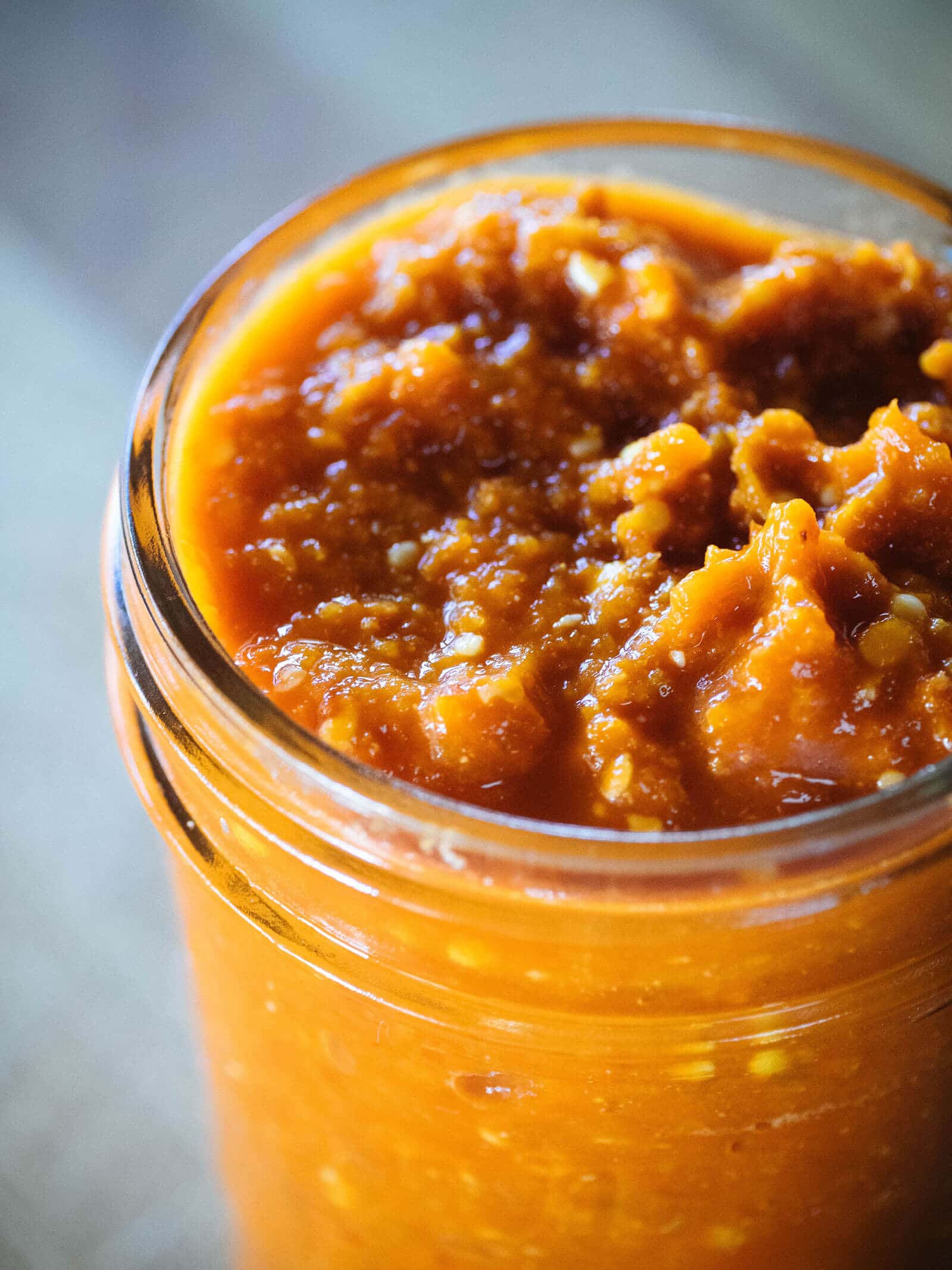 Chunky fermented hot sauce in a jar