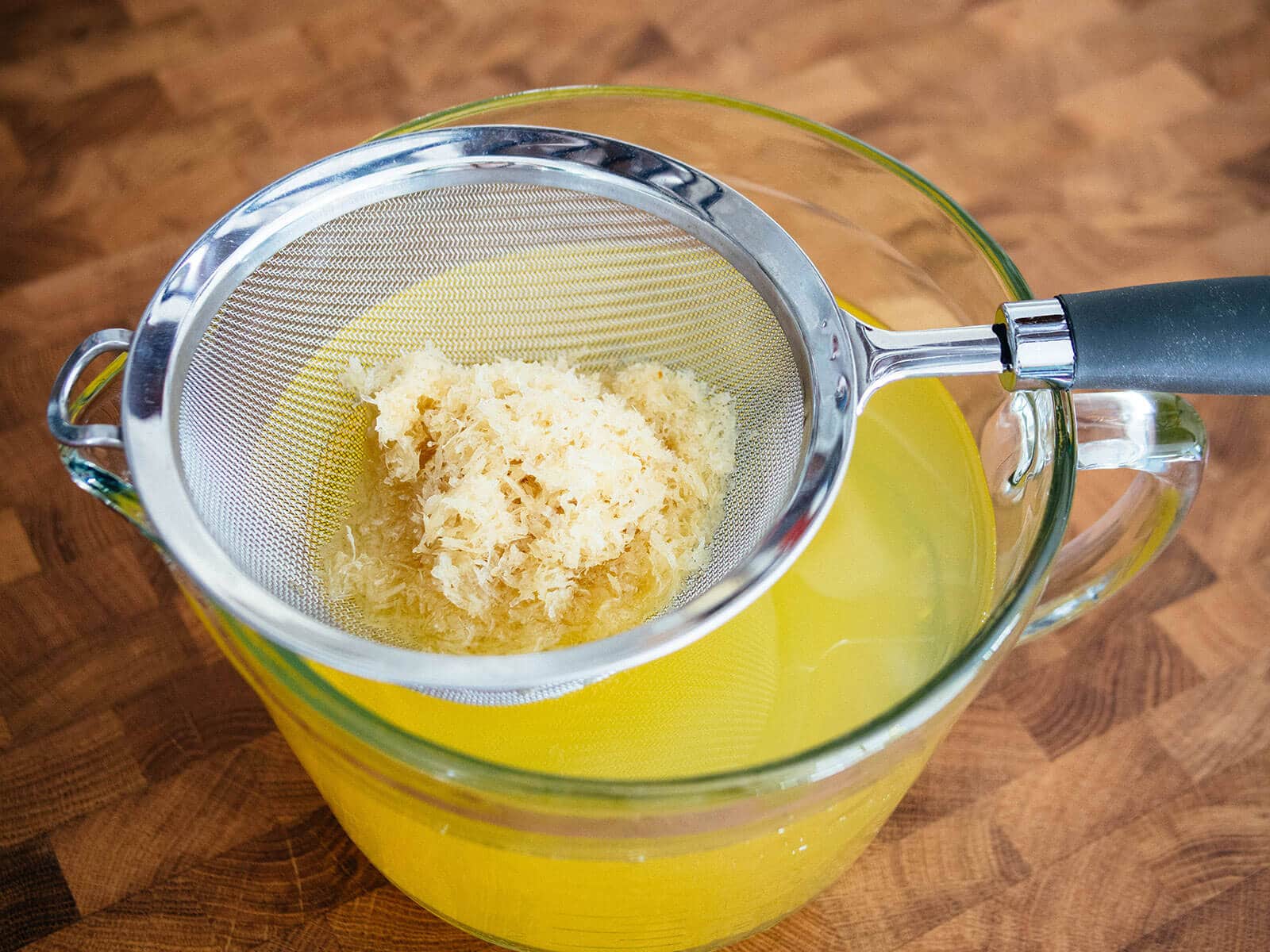 Lemon zest strained in a fine mesh sieve