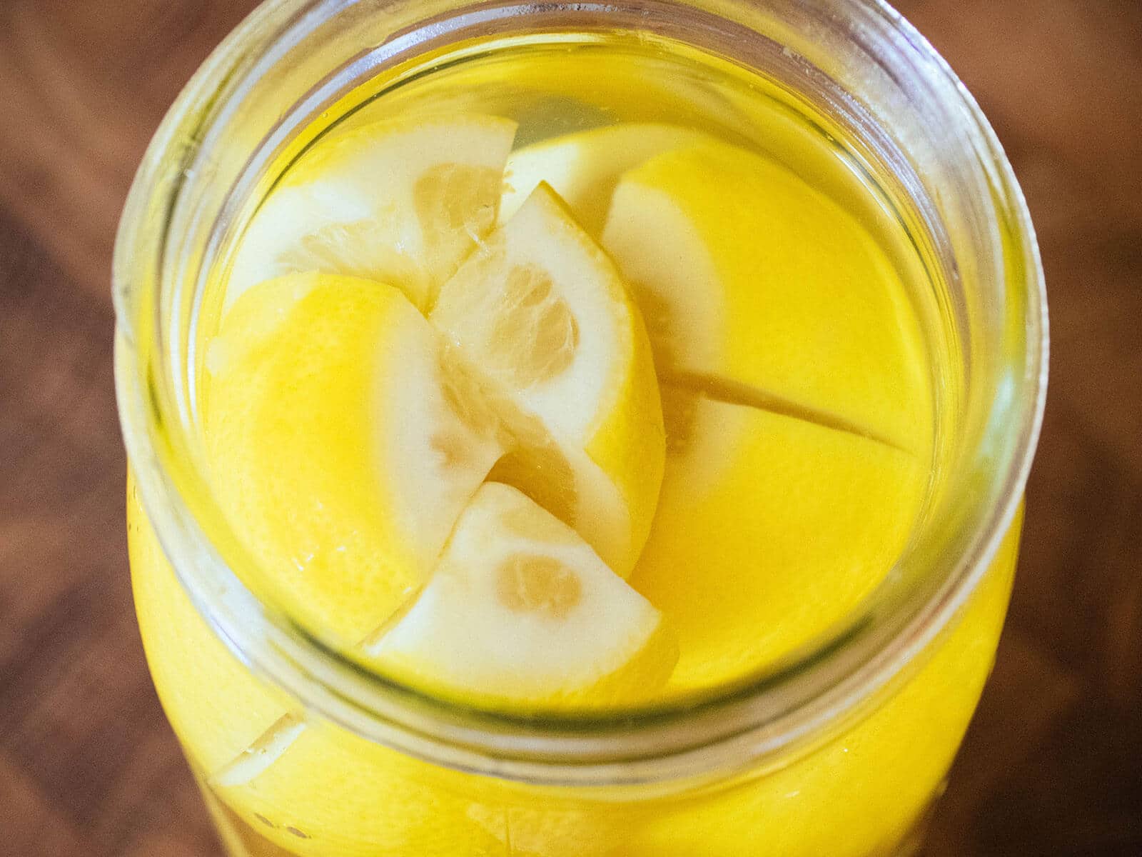 Salted lemons in a jar covered in brine